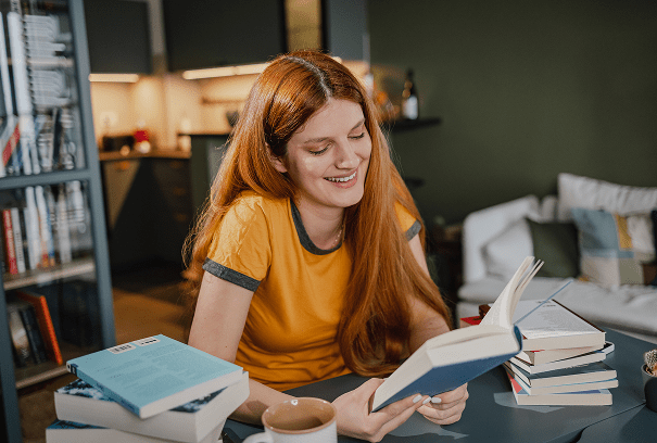 Woman reading in cozy living room